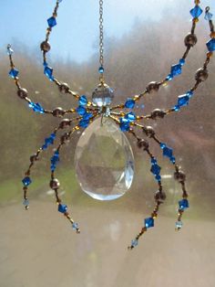 a spider made out of glass and beads