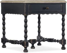 an antique wooden table with two drawers and one drawer on the bottom, is shown