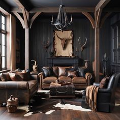 a living room with leather furniture and deer heads on the wall