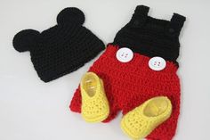 two crocheted mickey mouse hats and mittens are shown on a white surface