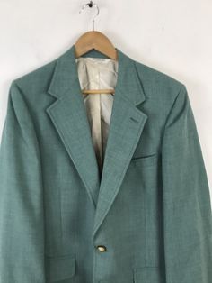 "-Description- >men's green sport coat with gold buttons >two button front >three buttons on the cuffs >two flap close and one open pocket on the front >vent in the back >partially lined >size 40 >perfect for a holiday party! >condition: great >color(s): green, gold >fabric(s): wool >brand: pbm >care: dry clean -Measurements- >size: 40 ✩ all measurements are taken with the item laying flat & some sizes are estimates so please check measurements ✩ che Classic Green Blazer With Button Closure, Retro Green Formal Outerwear, Classic Green Sport Coat With Button Closure, Classic Green Blazer With Button Cuffs, Classic Green Sport Coat With Suit Collar, Green Sport Coat With Button Closure For Formal Occasions, Formal Green Sport Coat With Button Closure, Vintage Green Long Sleeve Sport Coat, Vintage Tailored Green Blazer