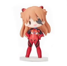 an anime character figurine holding a red cat on top of a white base