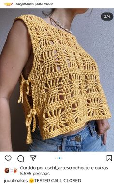 a woman wearing a yellow crochet top