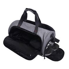 a grey and black duffel bag with wheels on the bottom, one side open