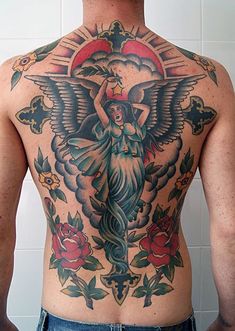 the back of a man with tattoos on his body