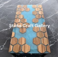 a table made out of wood and glass with the words stone craft gallery on it