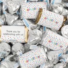 birthday candy wrapped in foil with the words happy birthday written on it and confetti wrappers