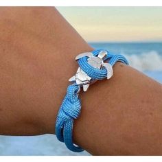 Beach Wear Accessory Blue Rope Silver Sea Turtle Bracelet One Size Fits All Details: * Sea Turtle Charm: 25mm * Eco-Friendly Alloy With Silver Finish * 4mm Thick Blue Rope * Adjustable Size Fits All E-6-Epm Adjustable Blue Jewelry For Vacation, Adjustable Blue Beach Jewelry, Adjustable Blue Jewelry For Beach, Adjustable Blue Strand Jewelry, Adjustable Blue Nautical Bracelets, Nautical Blue Bracelets As A Gift, Adjustable Blue Nautical Bracelet, Adjustable Blue Nautical Jewelry, Nautical Blue Bracelets For Gifts