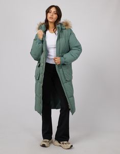 DESCRIPTION Embrace the cooler seasons with the Active Fur Longline Puffer in a refreshing green hue by All About Eve. This puffer jacket is a true cold-weather ally, featuring a snug faux fur-lined hood that brings a touch of luxury to your outdoor attire. Its extended length provides extra coverage, while the cinchable waist allows for a customisable fit. The soft green shade adds a pop of colour to dreary days, and the gold-tone hardware injects a dash of glamour. Ideal for layering over a cr Set In Sleeve, All About Eve, Day Time, Summer Knitting, Detachable Hood, White Tank Top, Black Blazers, Winter Looks, Nice Day