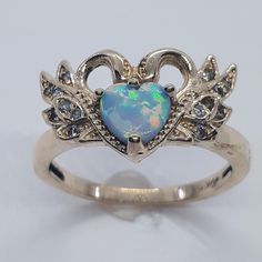 This stunning Opal ring has been carefully crafted in 10k Yellow Gold, Authentic Opal Stone and Authentic White Diamond. Great for any occasion! Buy it for your-self or for someone you love! This beautiful ring will not go unnoticed. All of my jewelry is handmade from scratch and of high quality.  Ring is size 7  but can be resized at no extra cost and will be shipped to you in an elegant gift box. A tracking shipping number will be provided to you once ring has been mailed. Ring Weight: 3.1 gra Heart-shaped Multi-stone Wedding Rings, Wedding Multi-stone Heart Rings, Gold Opal Jewelry, Swan Ring, Cute Promise Rings, Gold Ring Diamond, Ring Heart, Ring Opal, Opal Ring Gold