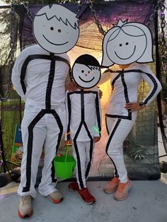 three people dressed in costumes standing next to each other with their faces painted on them