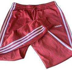 Adidas Red Bottoms For Spring, Red Adidas Bottoms For Spring, Pink Adidas Pants For Loungewear, Fitted Pink Adidas Bottoms, Pink Stretch Adidas Bottoms, Red Adidas Athleisure Pants, Adidas Red Cotton Pants, Adidas Sporty Moisture-wicking Joggers, Red Cotton Sporty Joggers