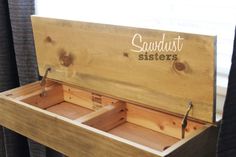 a wooden box that has some sort of drawers in it with the words sandhust sisters on it