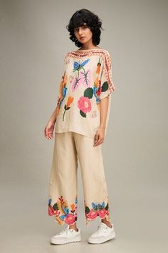 Beige kimono top with floral print and bead embellishment. Paired with pant. - Aza Fashions Bohemian Sets With Floral Embroidery For Summer, Bohemian Sets With Floral Embroidery For Spring, Bohemian Spring Sets With Floral Embroidery, Bohemian Beige Sets For Spring, Bohemian Summer Pants With Printed Motifs, Summer Bohemian Pants With Printed Motifs, Traditional Floral Embellished Sets For Summer, Bohemian Beige Floral Embroidered Sets, Bohemian Spring Sets With Printed Motifs