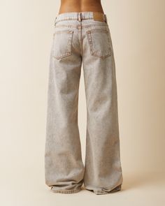 ’Kyoto’ is an effortlessly cool low waist denim with a slouchy loose flared silhouette. Featuring a zip fly, low waist and a wide leg from the thigh becoming even wider in the bottom. Made in a brown yarn dyed denim with more than 50% recycled content, finished with a heavy stonewash effect, and classic tobacco stitching. Linen Wide-leg Jeans With Pockets, Brown Washed Cotton Jeans, Relaxed Fit Soft-washed Cotton Jeans, High-rise Cotton Jeans With Seam Detailing, Luxury Garment-washed Cotton Jeans, Dyed Denim, Brown Yarn, Low Waist, 8 Weeks