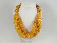 "Chunky gold yellow amber necklace,multi strand statement yellow necklace, beaded yellow necklace, big gold beads, amber statement jewelry,matching earrings available , A bold and dramatic statement necklace featuring acrylic yellow chip beads and huge yellow gemstone imittion beads. 3 strands, light weight. Gold plated lobster clasp Measurements: 19\" (49 cm) plus 3 1/2\" extender Each piece of jewelry from my shop comes beautifully packaged in box and ready for gift giving. Matching earrings a Yellow Multi-strand Jewelry As A Gift, Yellow Multi-strand Jewelry Gift, Yellow Double Strand Jewelry As Gift, Yellow Double Strand Jewelry For Gift, Handmade Amber Multi-strand Necklace, Yellow Double Strand Beaded Necklace, Handmade Yellow Double Strand Jewelry, Yellow Multi-strand Necklace For Gift, Handmade Yellow Double Strand Necklace