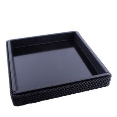 a black square tray with braiding on the edges and bottom, set against a white background