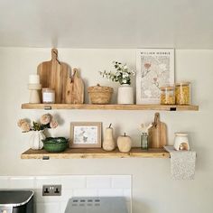 two wooden shelves above a stove in a kitchen