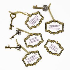 six antique key tags with words written on them and some keys attached to each other