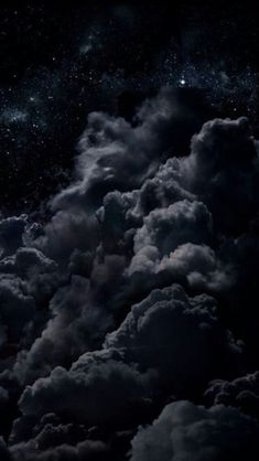 the night sky is full of clouds and stars