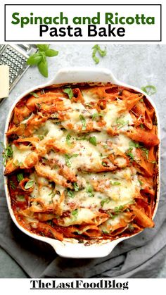 spinach and ricotta pasta bake in a white casserole dish with text overlay