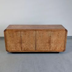 a large wooden cabinet sitting on top of a floor