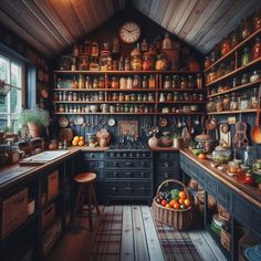 an old fashioned kitchen with lots of pots and pans on the shelves, along with other items