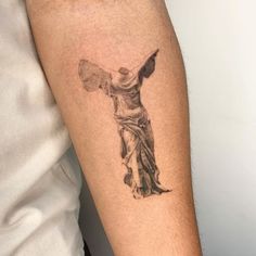 a person with a tattoo on their arm