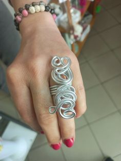 Big Silver Wire Ring, Long Statement Ring, Full Finger Woman's Ring, Unique Handmade Ring Elevate your style with this one-of-a-kind handcrafted aluminum wire ring in a stunning silver hue.  Made from high-quality aluminum, the ring features an intricate wire wrapping technique that adds a touch of elegance and uniqueness to your jewelry collection.  The lightweight nature of the material ensures comfort, making it ideal for everyday wear or special occasions. The package will be sent as soon as Unique Metal Stackable Rings For Anniversary, Wire Wrapped Open Metal Ring, Handmade Metal Stackable Rings For Anniversary, Handmade Silver Stackable Metal Rings, Silver Wire Wrapped Metal Rings, Unique Silver Wire Wrapped Rings, Silver Stackable Rings For Jewelry Making, Full Finger Ring, Silver Wire Rings