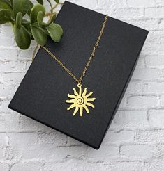 "This is a beautiful shiny gold stainless steel modern sun necklace. This necklace is all stainless steel - chain, charm, lobster clasp and jump rings.  This necklace is the same on both sides and perfect to wear all the time.   The modern sun charm measures 1 inches in diameter. I also have this necklace in natural silver stainless steel: https://www.etsy.com/listing/1069641156/stainless-steel-sun-necklace-on-a?click_key=675dc499c5d80b2a229754eada1cd891d8534512%3A1069641156&click_sum=fdd1aae1&g Sun And Moon Design Necklace As A Gift, Minimalist Sun Design Necklace As Gift, Metal Sun Design Necklace As Gift, Gold Sun Design Necklace In Metal, Minimalist Gold Necklace With Sun Design, Trendy Gold Jewelry With Sun Design, Sun Minimalist, Hypoallergenic Necklace, Sun Charm