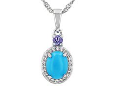 9x7mm Oval Sleeping Beauty Turquoise, 0.09ct Round Tanzanite With 0.17ctw Round White Zircon Rhodium Over Silver Pendant With 18"Singapore Chain. Measures Approximately 0.94"L x 0.40"W. 2.5mm bail. Lobster clasp with 2"extender. Accent stones primarily zircon. Turquoise Oval Jewelry With Halo Setting, Turquoise Oval Jewelry With Diamond Accents, Oval Turquoise Jewelry With Diamond Accents, Oval Turquoise Jewelry With Halo Setting, Oval Turquoise Gemstones With Accents, Oval Turquoise Gemstones With Accent Stones, Pendant With Chain, Sleeping Beauty Turquoise, Lobster Clasp