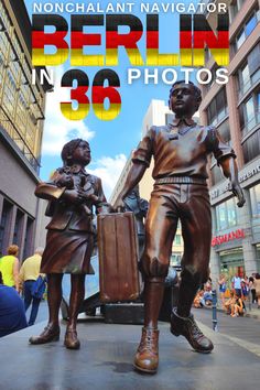 there is a statue of two people walking down the street with luggage in their hands