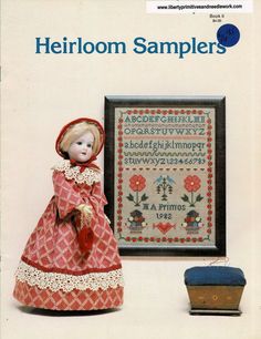 an old fashioned doll is next to a cross stitch sample from the book heir samples