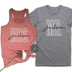 two shirts with the words mrs and mr written in black on them, next to a flower