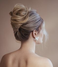 Brunette bride with modern french twist hairstyle for wedding.