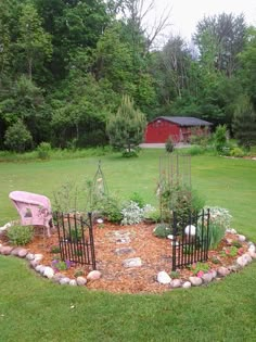 a small garden in the middle of a yard