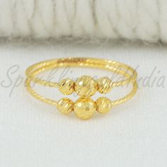 Please click -- Learn more about this item -- below for a full description 22k gold ring handmade jewelry made in India Metal is Real Gold Not Filled or Not Gold Plated Metal - Yellow Gold Metal Purity - 22kt Gold weight is 1.12 grams approx. Ring Size is 6.25 US, width is 0.4 centimeter please choose for other size from drop down list Feel free to ask if have any questions.                                      Returns & exchanges & Cancellations              If any return or Cancellations a 20% fees (etsy,paypal fees) will be deducted from the total amount . Conditions of return Buyer is responsible for return shipping costs Buyer is responsible for loss in value (as agreed upon with seller) if an item isn't returned in original condition. Indian Gold Ring, 22k Gold Ring, Beads Ring, Gift Jewelry, Beaded Rings, 22k Gold, Ring Handmade, Real Gold, Rings Statement