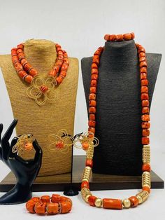 Handcrafted African Coral Beads Necklace - Unique Ethnic Jewelry for a Statement Look NEED OTHER DESIGNS OF BRIDE AND GROOM CORAL BEADS, AFRICAN PRE-TIED HEADWRAPS, BRAIDED WIGS AND AFRICAN GIFT ITEMS, VISIT OUR SHOP HERE: https://sereneafrica.etsy.com/ Materials: 1. Natural/Original African Coral bead 2. Gold color accessories.  3. This listing contains 2 layers of necklace, 2 bracelets, a set of dangling earrings for bride/woman 1 piece of necklace and 1 bracelet for men. PLEASE NOTE THE VARIA Handmade Gold Beaded Necklaces For Traditional Ceremonies, Bohemian Large Beads For Wedding, Bohemian Gemstone Beads For Wedding, Traditional Gold Beaded Necklaces For Wedding, Bohemian Polished Beads For Wedding, Bohemian Beaded Necklaces For Wedding, Bohemian Beaded Necklaces With Round Beads For Wedding, Bohemian Beaded Necklace With Round Beads For Wedding, Bohemian Beaded Necklaces With Large Beads For Weddings