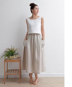 "★★FEATURES 100% Linen  Two big pockets Plus size Linen skirt A Line skirt Casual Linen skirt Perfect for Summer, Spring, Autumn ★★ Model Size Height approx 172 cm (5′ 8″)  Bust 84 cm (33\")  Waist 66 cm (26\")  She wears size XS. ★★ Bespoke Order Service If you Request other color Request the length Your height is not between 155 cm- 172 cm Your weight is over 75 kg I can do it for you, It will need some extra fee depending on on your need. Contact with me for more detail. ★★ Warmly Note: 1 ) : Casual Beige Full Skirt Bottoms, Casual Full Skirt In Beige, Casual Beige Full Skirt, Beige Full Skirt With Pockets, Linen Skirt Set, Casual Beige Midi Skirt, Beige Flared Skirt With Pockets, Casual Beige Gathered Skirt, White Full Skirt With Pockets