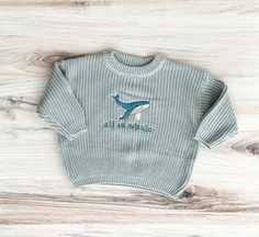 This is a one of a kind embroidered knit sweater that your little one will absolutely love. This is the perfect gift! HOW TO ORDER Select your sweater size and color from the first dropdown menu. Please note: These sweaters are meant to fit oversized. If you would like your sweater more fitted size down.  To send a sweater directly to the recipient, please mark "This order is a gift" at checkout and include a gift message. SHIPPING  Your sweater will ship within 4-7 business days. All shipments Blue Winter Sweater With Embroidered Text, Winter Blue Sweater With Embroidered Text, Cute Embroidered Knit Tops, Cute Winter Sweater With Embroidered Text, Toddler Sweater, Baby And Toddler, Saint George, Gift Message, Kids Sweater