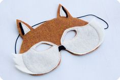 a felt fox mask is shown on a white surface