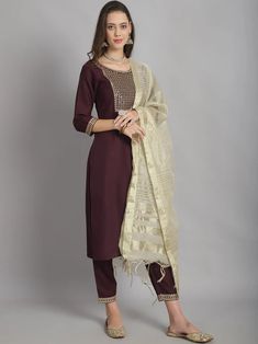 Grab this beautiful 3-piece set. The set comes with straight shape yoke detailing kurta has round neck, 3/4th sleeves & calf length teamed with matching bottom and a white chanderi cotton dupatta to match. Color - Burgandy Kurta Fabric-Viscose Pant Fabric-Viscose Dupatta Fabric- Chanderi Cotton Neck-Round Neck Sleeves-3/4th Sleeves Work - Yoke Work Detailing Washing Instructions-Dry Clean Model Height - 5.5 wearing size small. DISCLAIMER - The color of the product may be differ due to screen settings of device. A misprint here and a color drop slip there is the beauty of printing which is not treated as a defect. Eid Straight Kurta With Set-in Sleeves, Traditional Festive Set With 3/4 Sleeves, Festive 3/4 Sleeve Sets, Festive Kurta With Set-in Sleeves, Festive Sets With Resham Embroidery And 3/4 Sleeve, Festive Fitted Sets With 3/4 Sleeve, Traditional Festive Pant Set With Set-in Sleeves, Traditional Kurta With Set-in Sleeves For Eid, Festive Straight Kurta With Set-in Sleeves