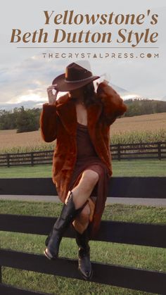 a woman sitting on top of a wooden fence wearing a hat and coat with the words yellowstone's beth dutton style