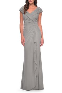 Simple net jersey gown with flattering ruching throughout waist and top. V neckline and slight off the shoulder sleeves. Back zipper closure. 60" length (Size 4) Back zip closure Off-the-shoulder neck Cap sleeves Full-length skirt Lined 100% polyester Spot clean Imported Nets Jersey, Off The Shoulder Sleeves, Full Length Skirts, Bride Dresses, Long Gown, V Neckline, Mother Of The Bride Dresses, Shoulder Sleeve, Mother Of The Bride