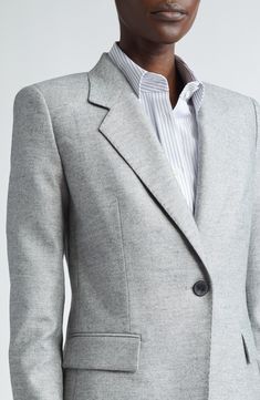 The NYC-based fashion house brings forth another foundational wardrobe essential with a softly tailored blazer cut from a luxurious silk-kissed wool blend. 28" length (size 8) One-button closure Notched lapels Front flap pockets Partially lined 79% virgin wool, 17% silk, 3% polyamide, 1% elastane Dry clean Imported Designer Clothing Classic Structured Formal Blazer, Formal Blazer With Structured Boning For Fall, Elegant Fall Sport Coat With Notch Lapel, Elegant Notch Lapel Sport Coat For Fall, Classic Structured Blazer For Formal Occasions, Formal Fall Blazer With Concealed Placket, Classic Structured Formal Suits, Classic Structured Suits For Formal Occasions, Structured Formal Blazer For Winter