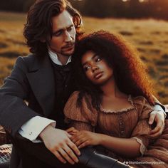 an image of a man and woman that are posing for the camera in front of a field