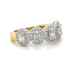 three stone diamond ring in yellow gold