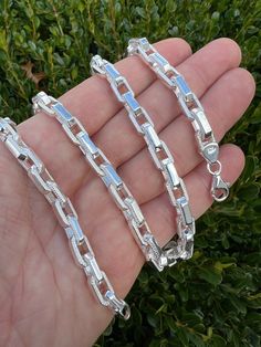 Gorgeous solid 925 sterling silver Hermes link rolo chains or bracelets
Handmade custom design...search anywhere you wont find this chain made by anyone else! Great for those that like something unique and handmade!
 
7mm thick so great to wear alone or with a pendant
 
Solid 925 sterling silver so wont change color or tarnish
Stamped 925...Made in Italy
 
These chains are solid and heavy.
 
18-24" ranging from 72-96 grams of pure 925 sterling silver...24" weighs 96 grams...8" bracelet Sterling Silver Rolo Chain Bracelet, Silver Rectangular Link Rolo Chain Jewelry, Rolo Chain, Real Gold, Solid 925 Sterling Silver, Handmade Bracelets, Jewelry Care, Custom Jewelry, Jewelry Pieces