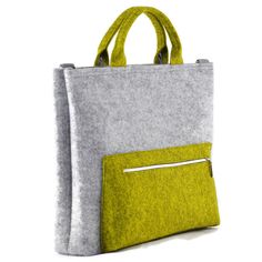 This is a designed and made by me gray and lime green felt laptop bag. It is made out of strong technical felt, 4mm thick. Simple minimalist design. The bag looks really nice. Measurements: height 33 cm/ 13 inch depth 7 cm/ 3.5 inch maximum width 39 cm/ 15.5 inch The bag has a zip closure. It was made taking care of each small detail. - 1 zippered pocked in front of the bag - 1 large compartment (35,5x24cm/ 14x9,5 inch) - e.g. tablet, documents, etc. - 1 zippered pocket inside, - 1 mobile pocket Grey Bag, Tote Bag Pattern, Grey Fashion, Laptop Bag, Leather Handle, Inside Pocket, Modern Minimalist, Lime Green, Bag Pattern