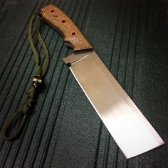 a large knife sitting on top of a table